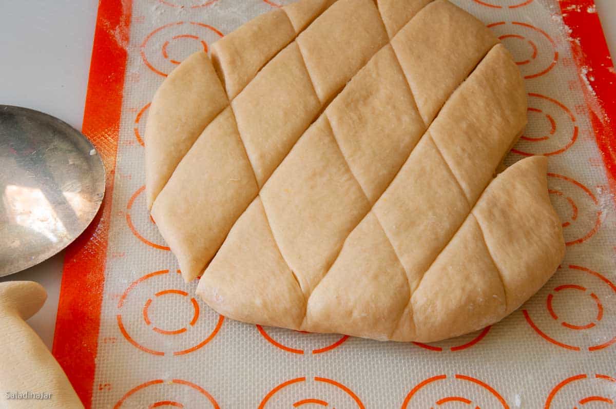 cut the dough into diamonds with a pizza cutter.