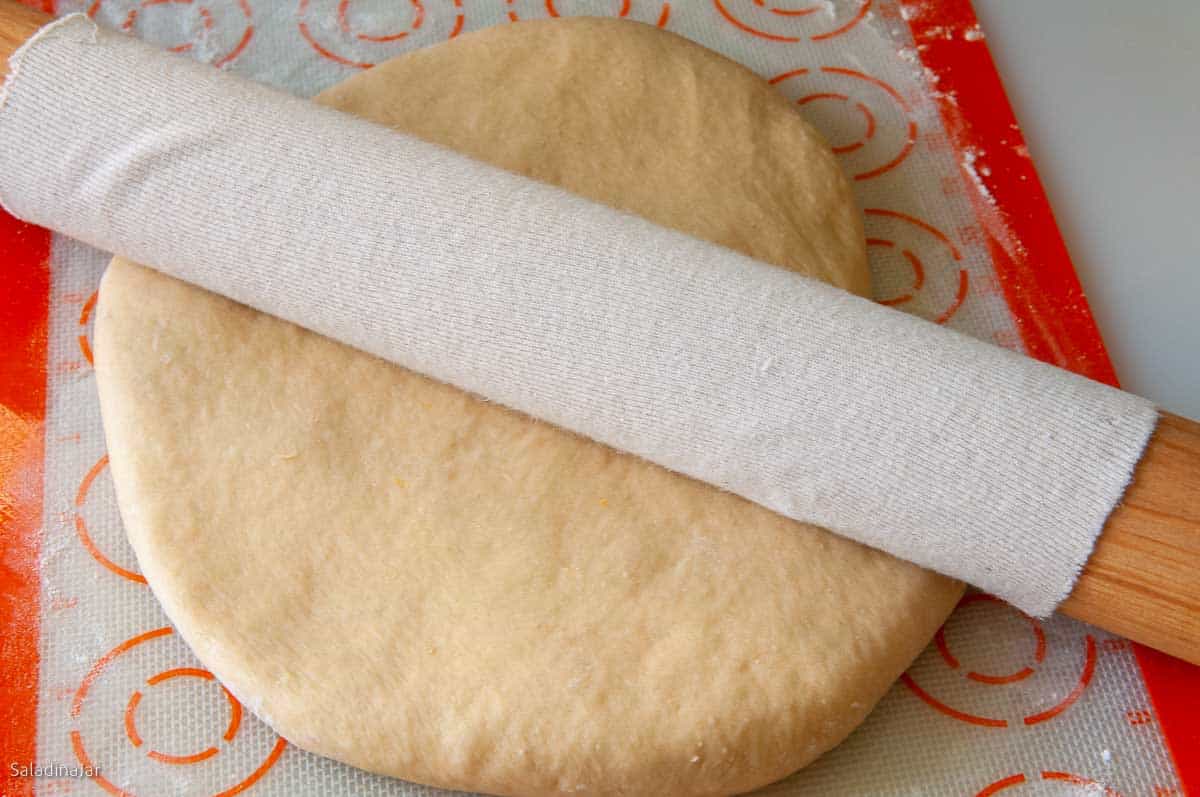 roll dough with a rolling pin.