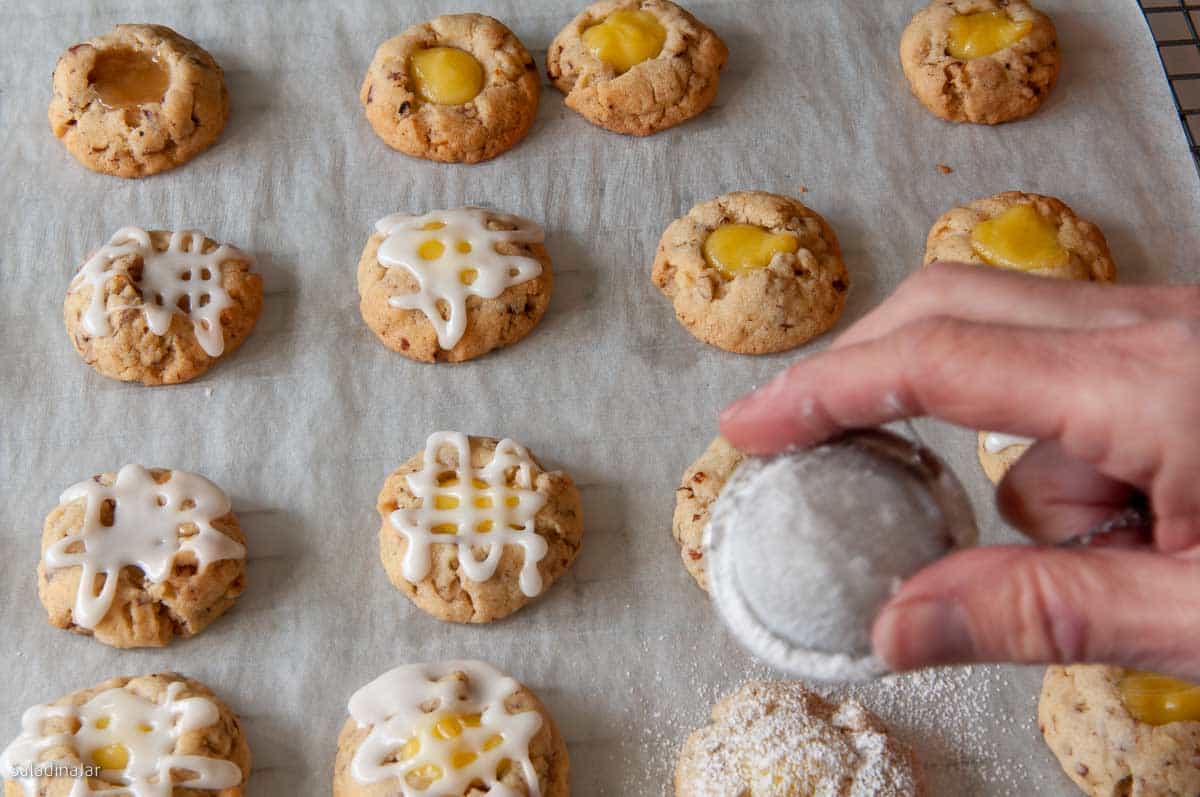 decorating lemon curd cookies with icing or powdered sugar.