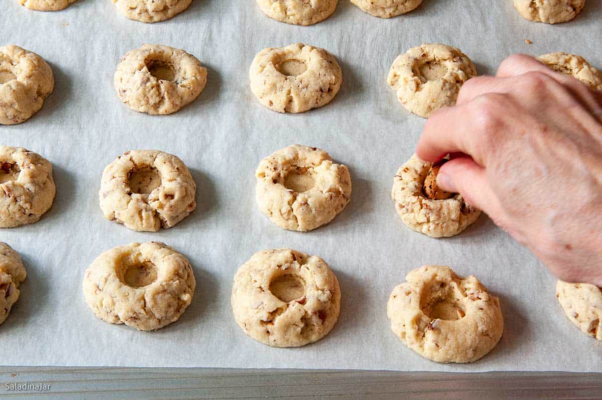 Re-pressing the holes with a cork before filling with lemon curd.