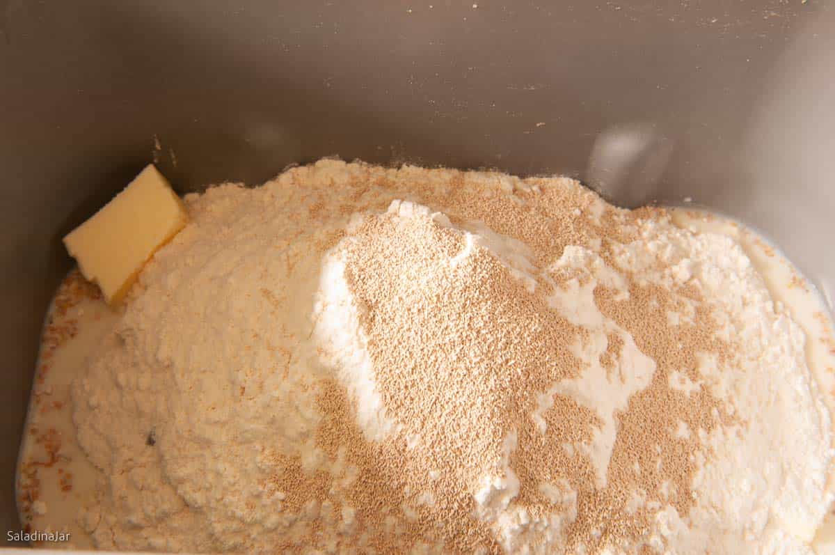 all ingredients for dough in bread maker pan