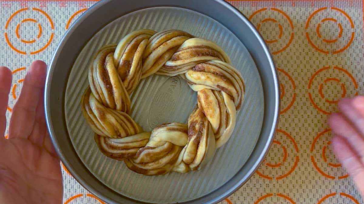 The bread is shaped and dropped into an 8-inch round pan.