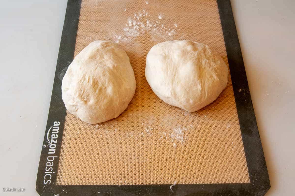 Dividing the dough into two equal portions.