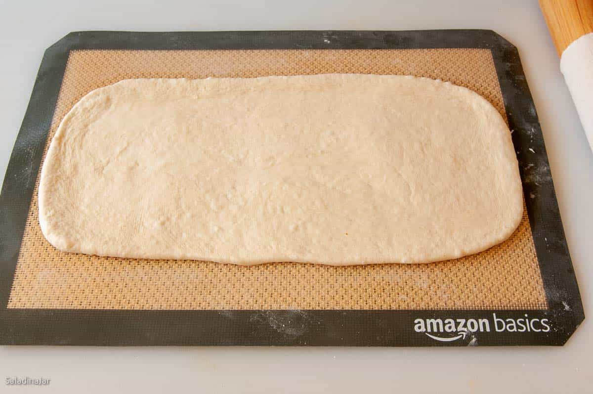 Rolling out the dough to a 9 x 13-inch rectangle.
