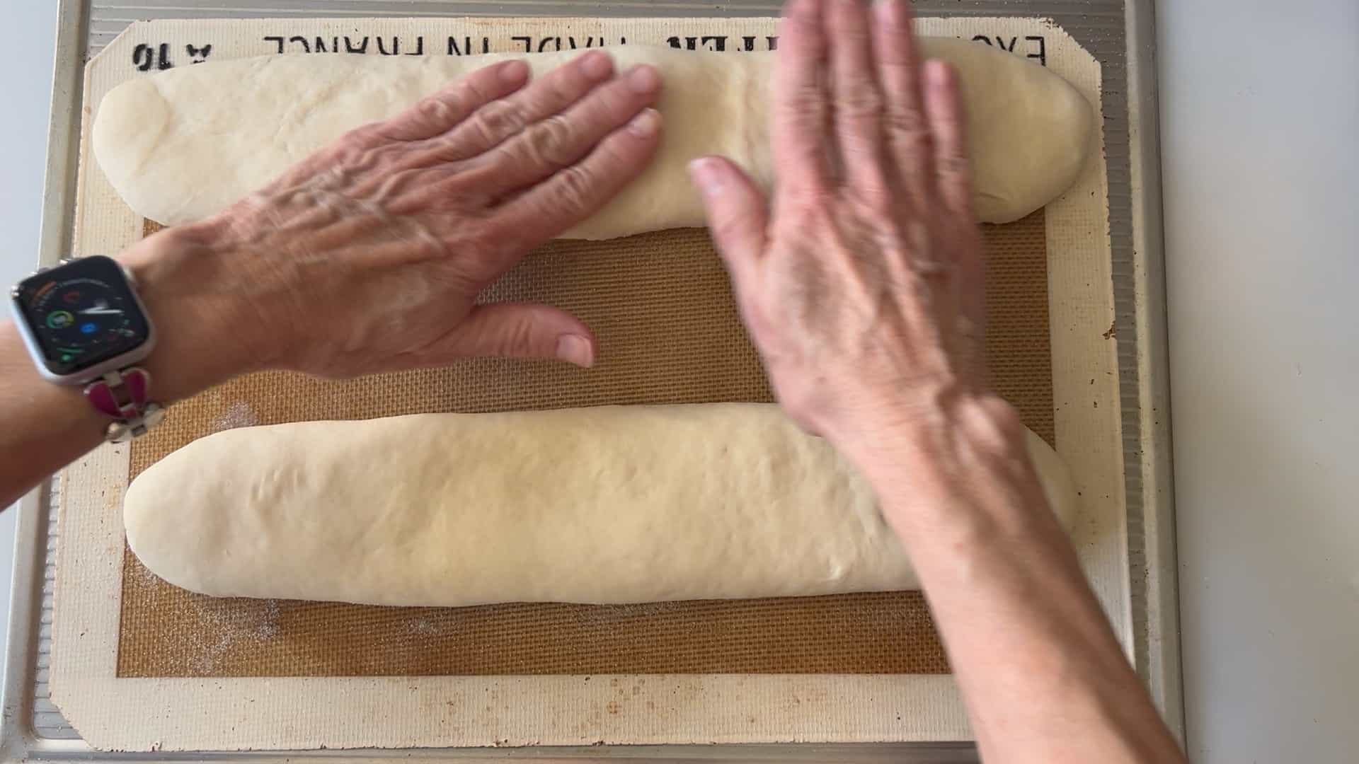 using fingers to flatten the pan cubano