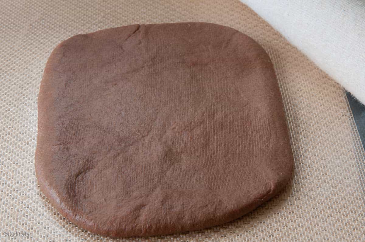 rolling dough into a rectangle.