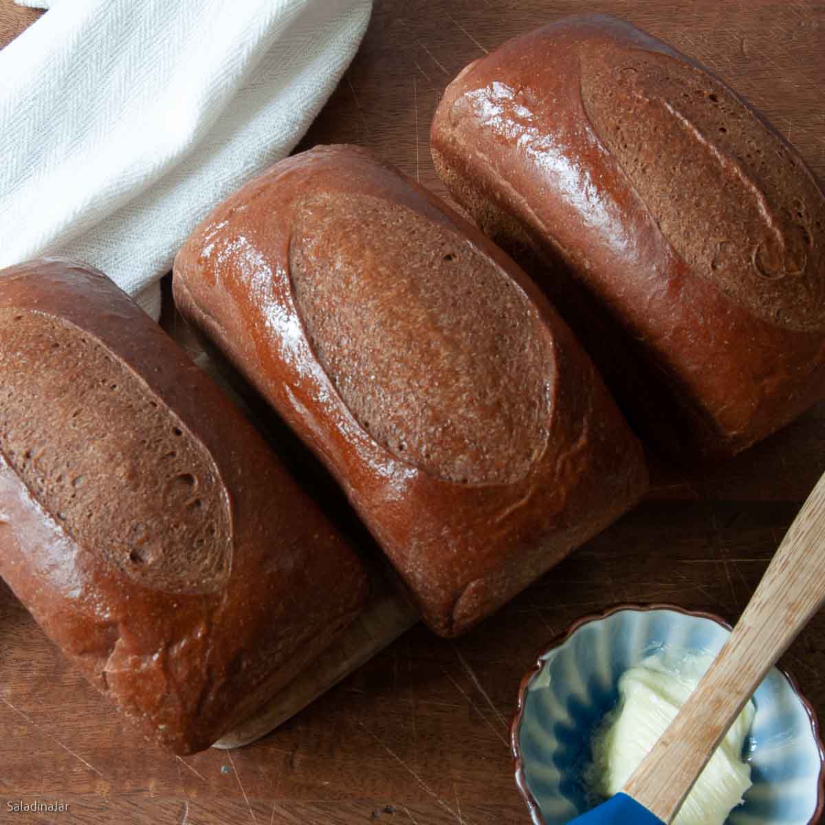 Three mini-loaves of steakhouse bread.