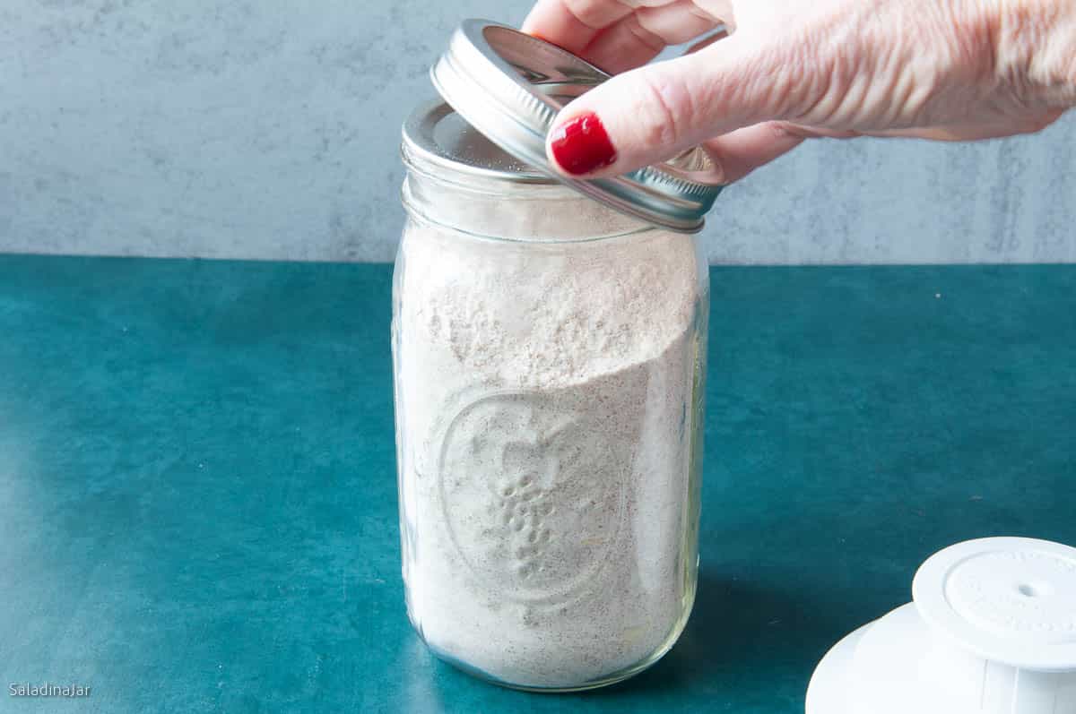 showing a wide-mouth Mason jar that has been vacuum sealed.