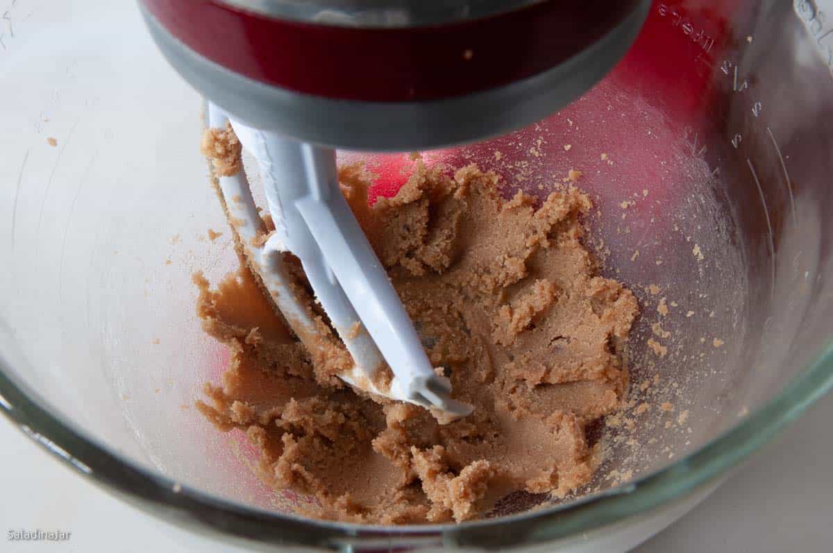 Creaming the butter and sugar with a stand mixer.