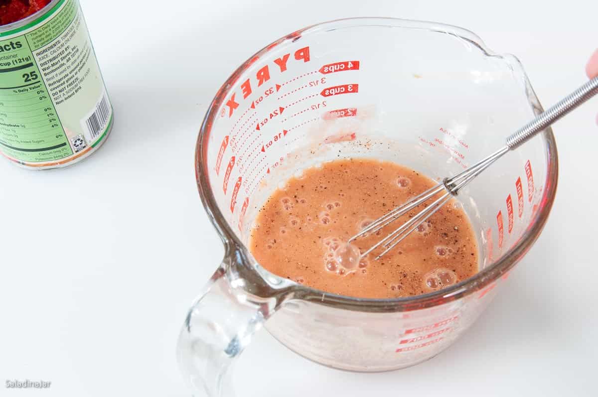 whisking flour and spices into gravy
