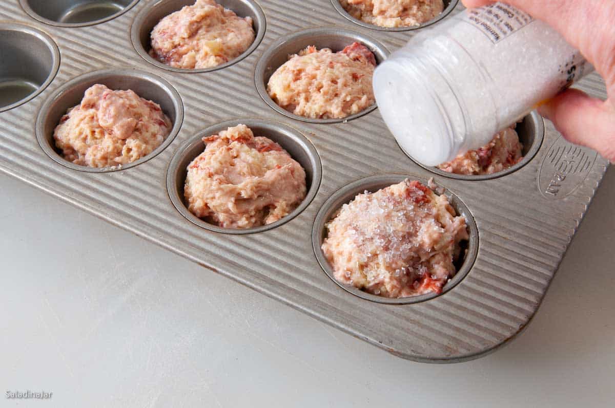 batter in muffin cups--sprinkling with sanding sugar.