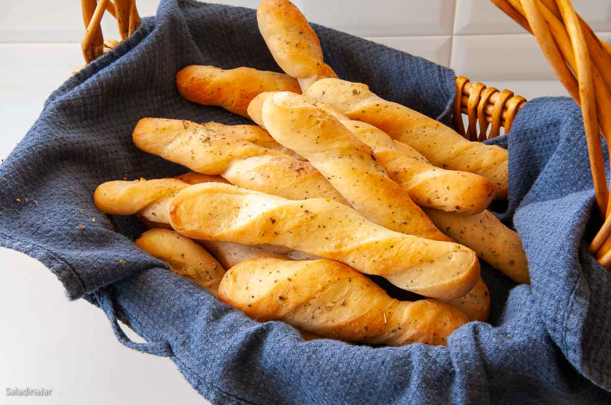 baked bread sticks in a basket.