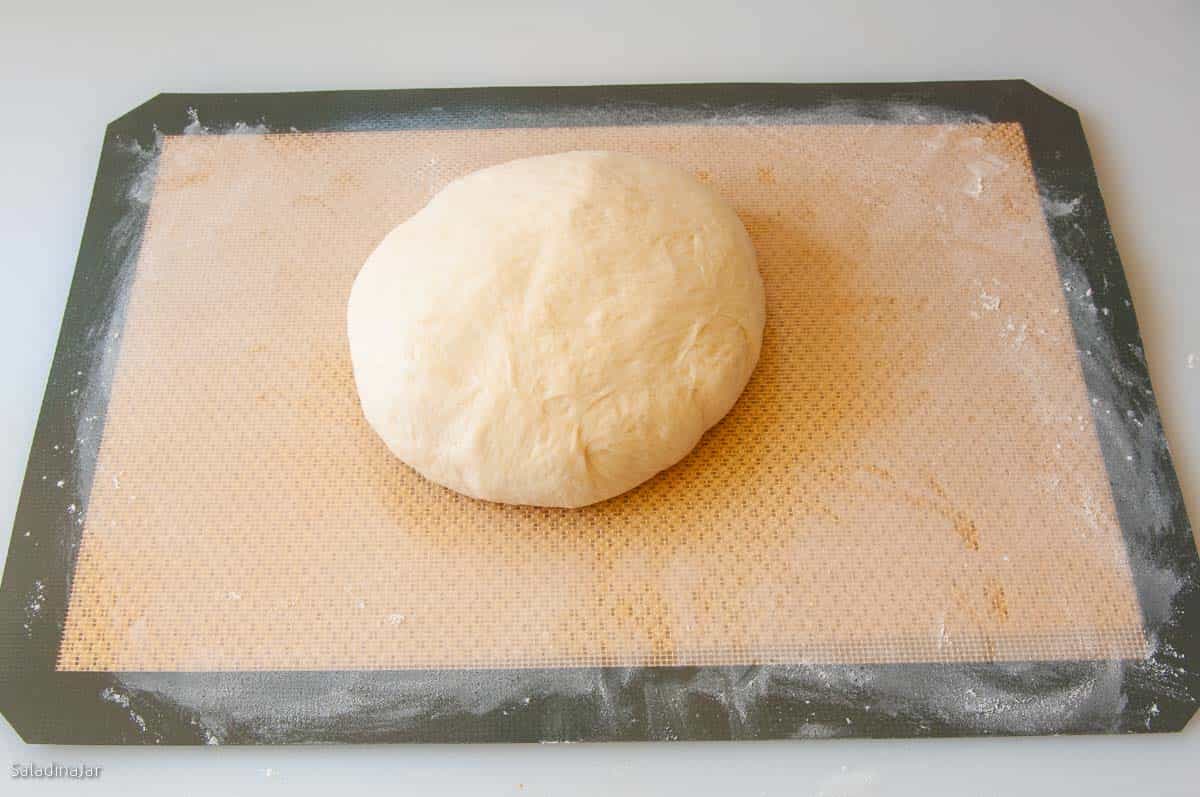 shaping the dough into a ball.