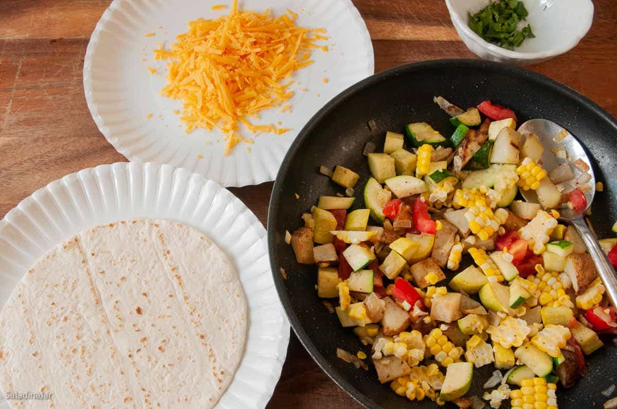 making soft tacos with calabacitas.