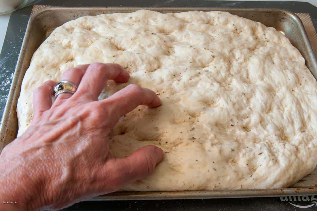 gently dimpling the dough.