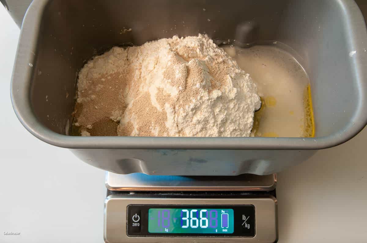 Using a digital scale to weigh all the ingredients.