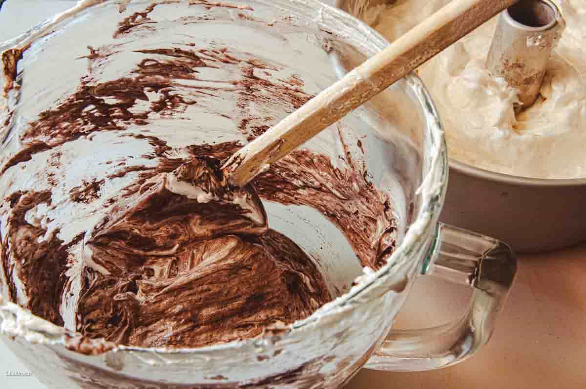 Adding the chocolate batter to the pan.