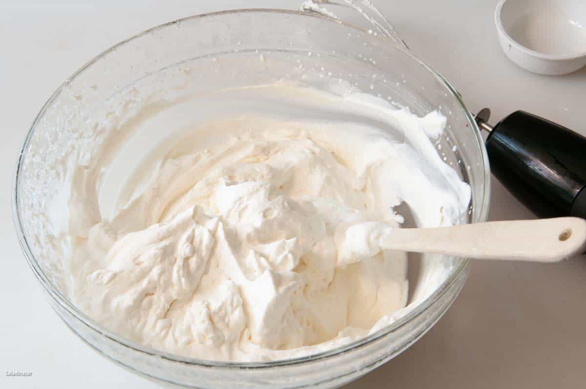 Heavy cream whipped until thickened and it holds a stiff peak.