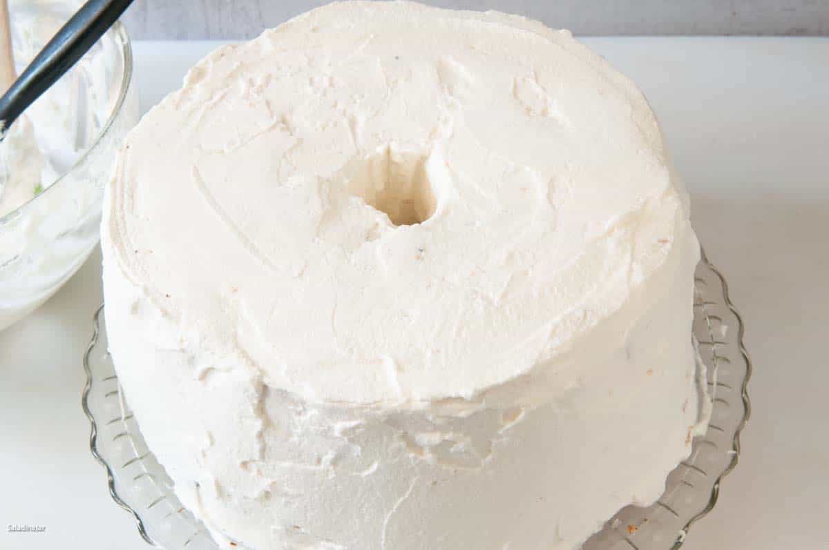 scratch angel food cake after it has been frosted.