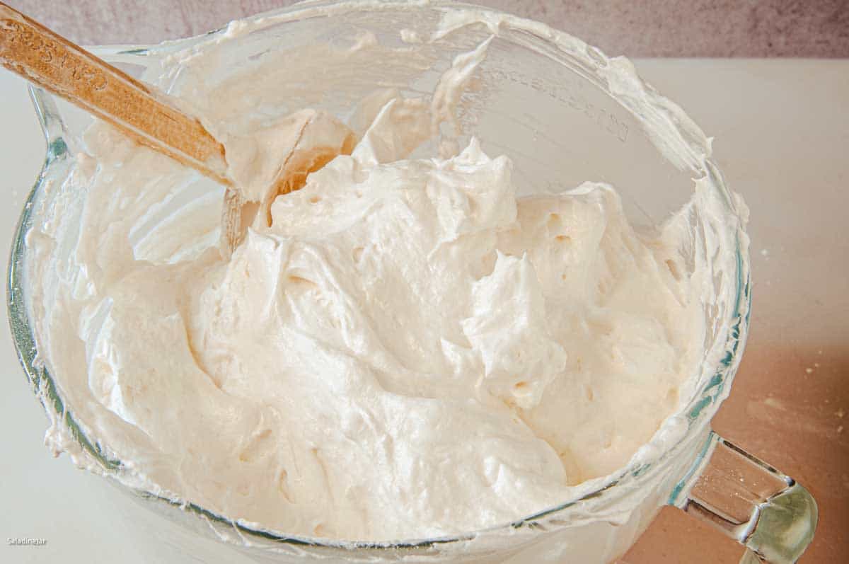 folding the sugar/flour mixture into the thick egg whites.