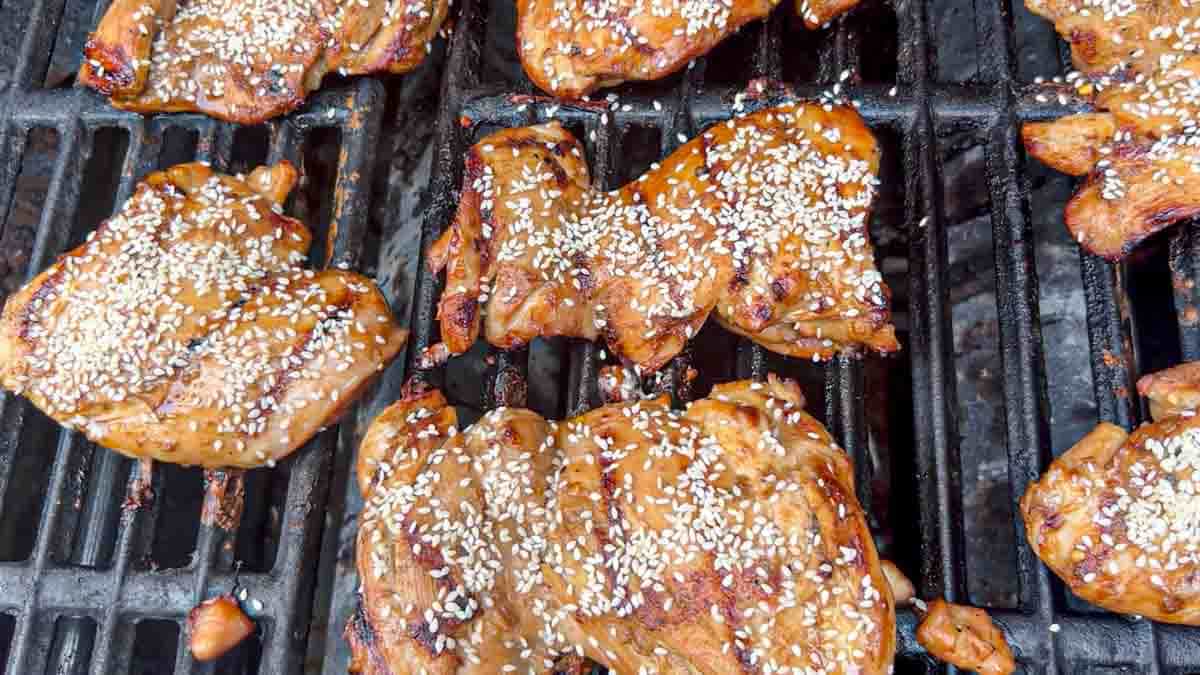 grilled boneless, skinless chicken thighs with sesame seeds.