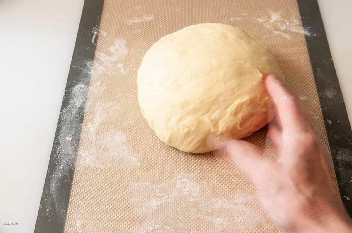 forming dough into a smooth ball.