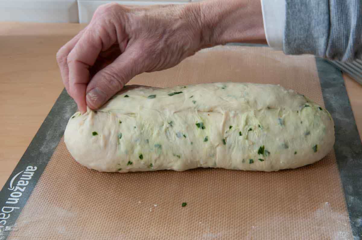 Turn up the ends and pinch with your fingertips to ensure the loaf is sealed.