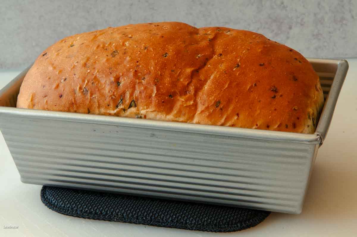 Baked loaf still in the pan.