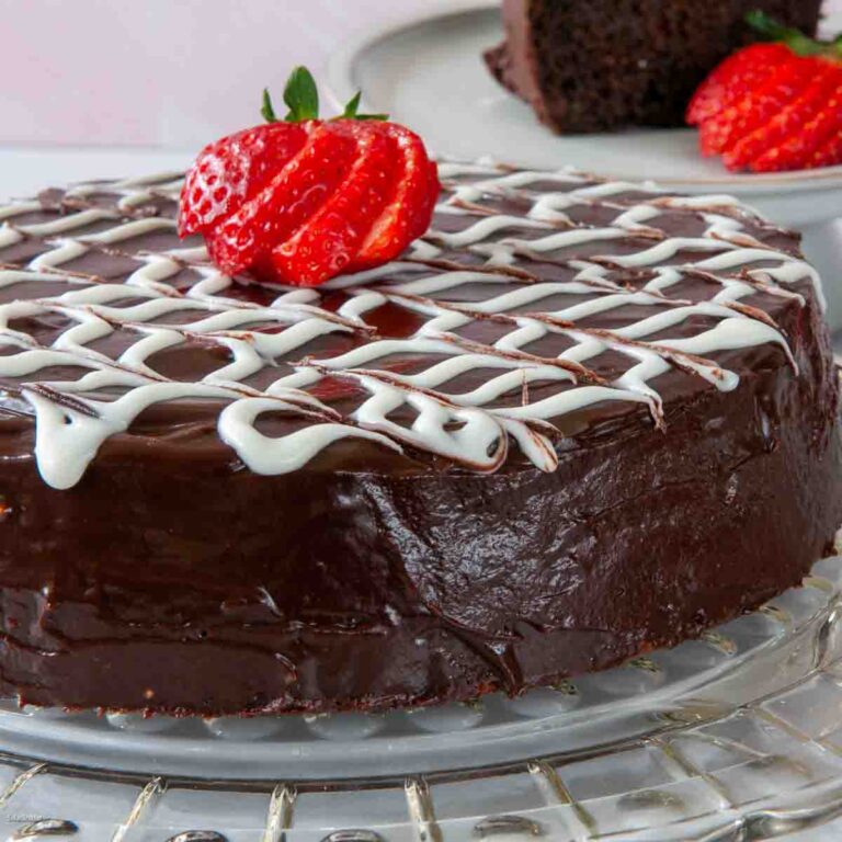 Glazed Fudge Cake made in a food processor with a strawberry garnish.