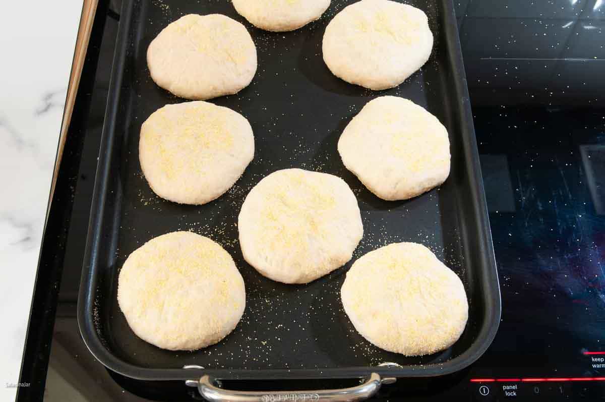 Frying the muffins on top of the stove using a grill pan.