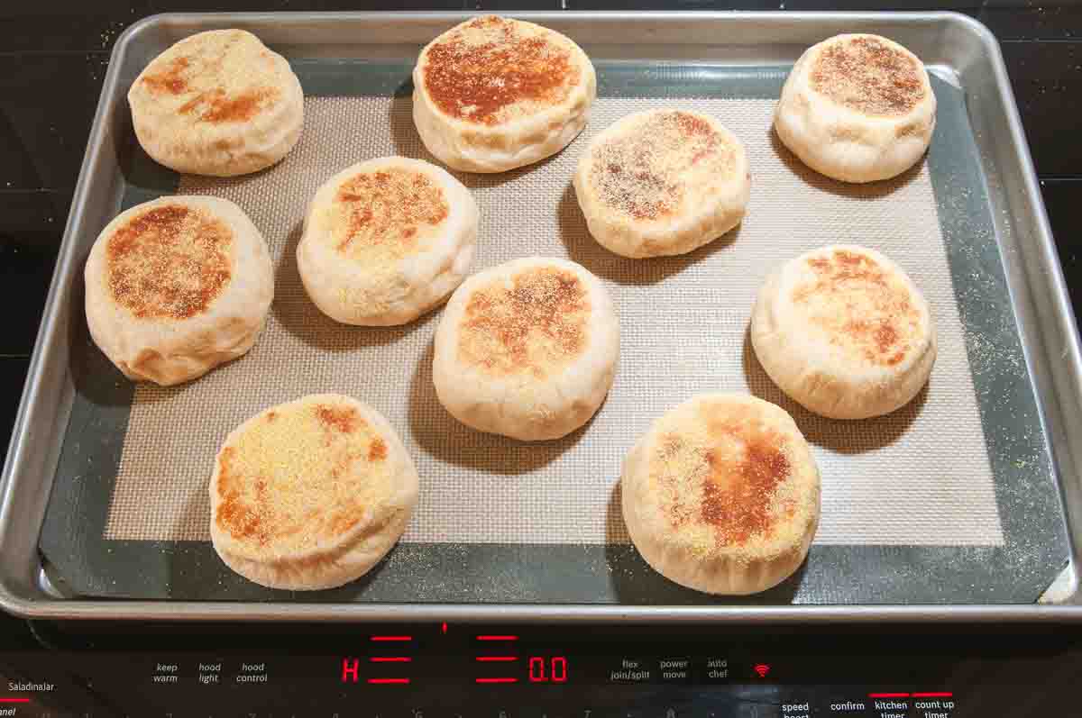 Place browned muffins back on the baking sheet.