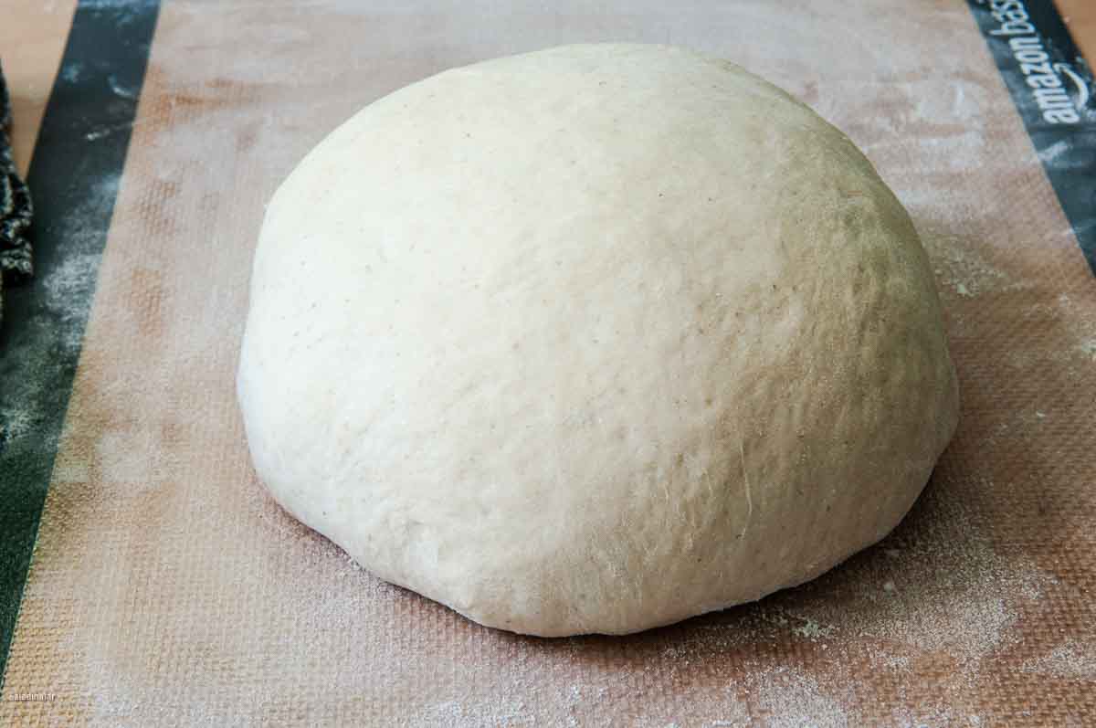 After the dough cycle ends, dough is shaped into a ball.