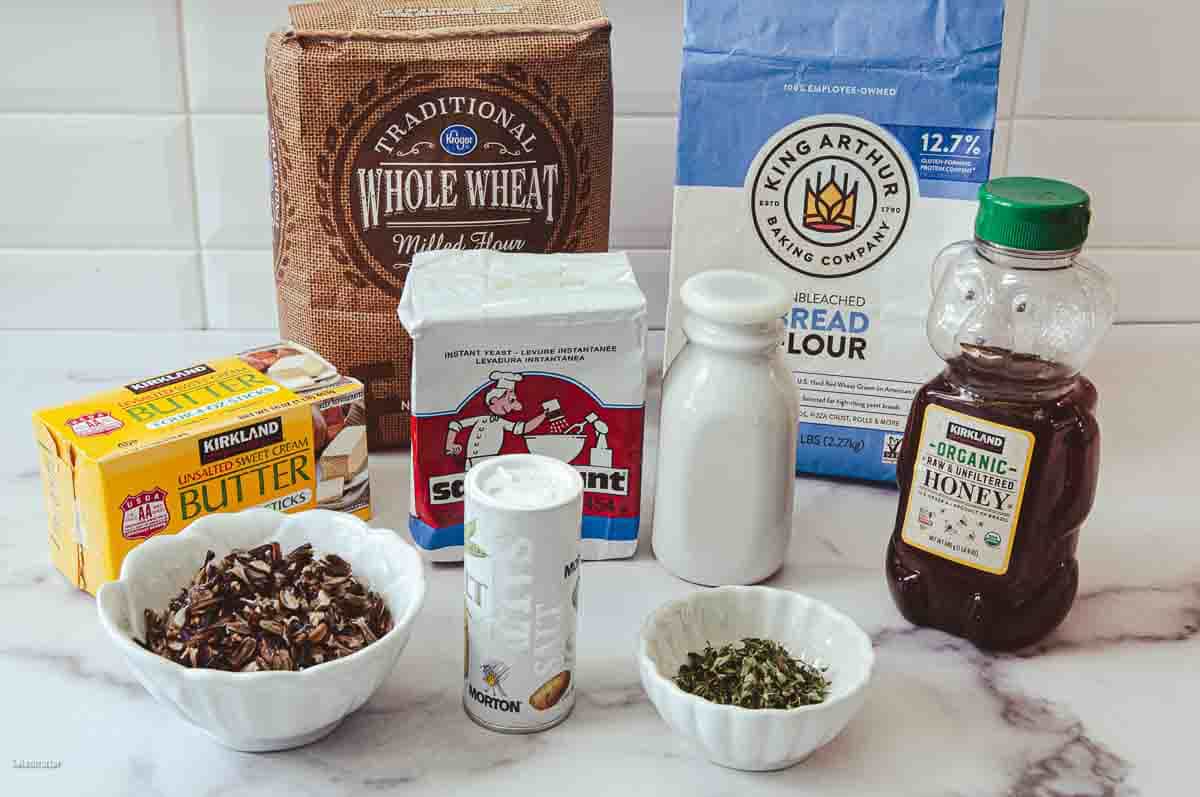 Ingredients needed to make the soft but hardy wild rice loaf with whole wheat and honey.