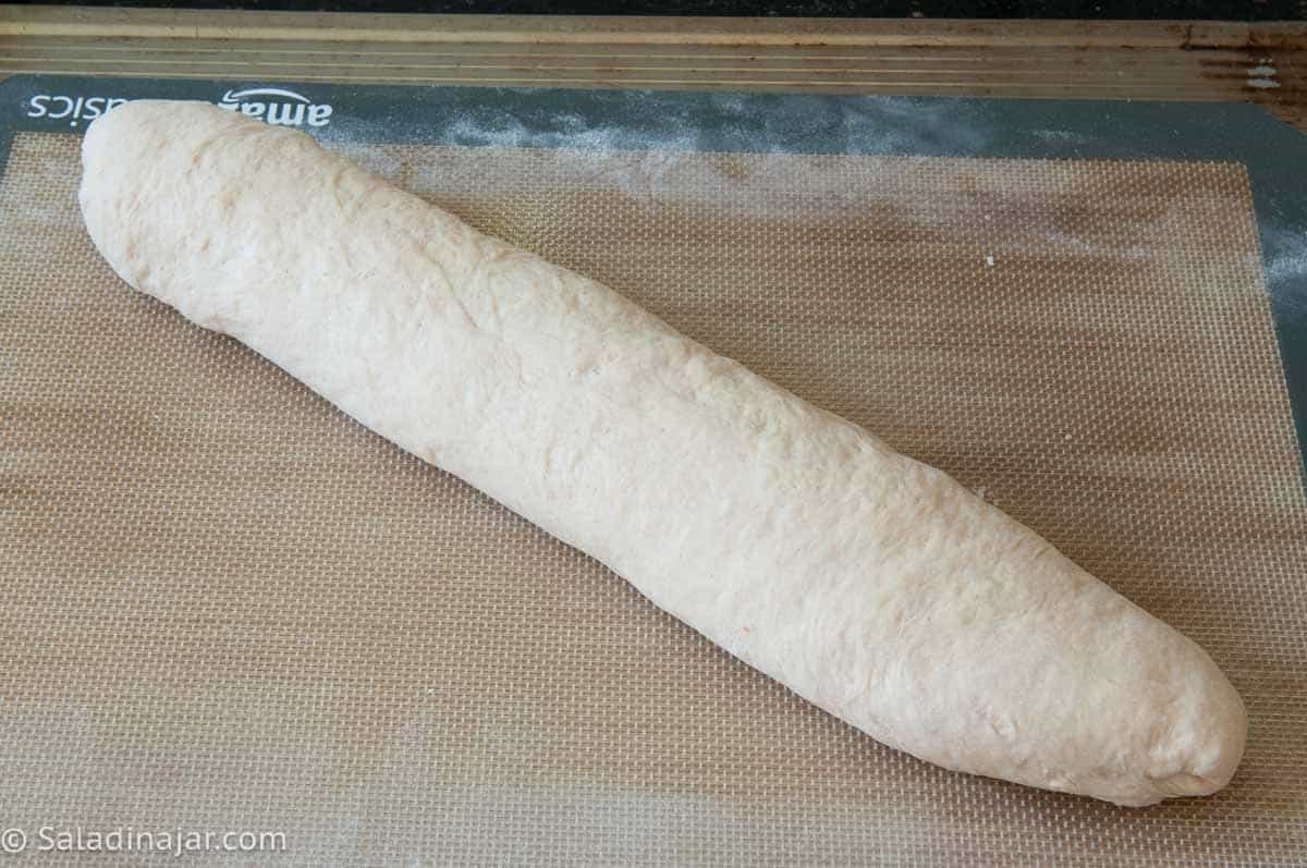 Rolling the cylinder over and shaping the ends.