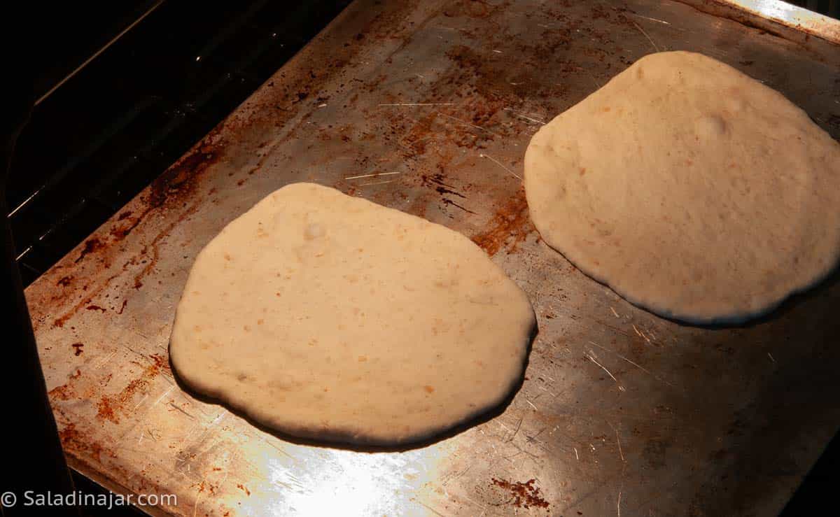 Into the oven--before the pitas puff.